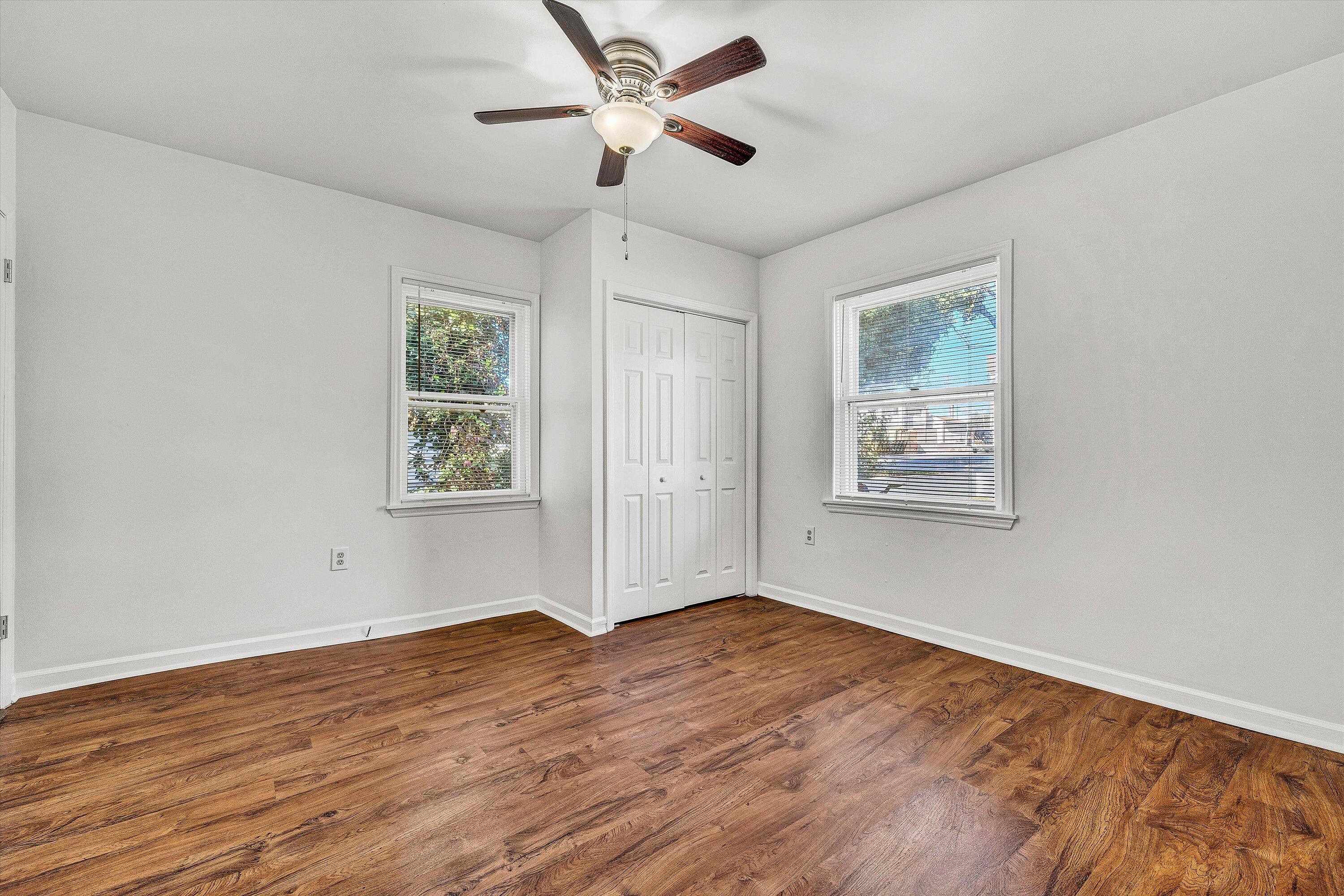 115 Liberty Road Northeast Roanoke, VA 24012 - Photo 6 of 24 a view of an empty room with window and wooden floor