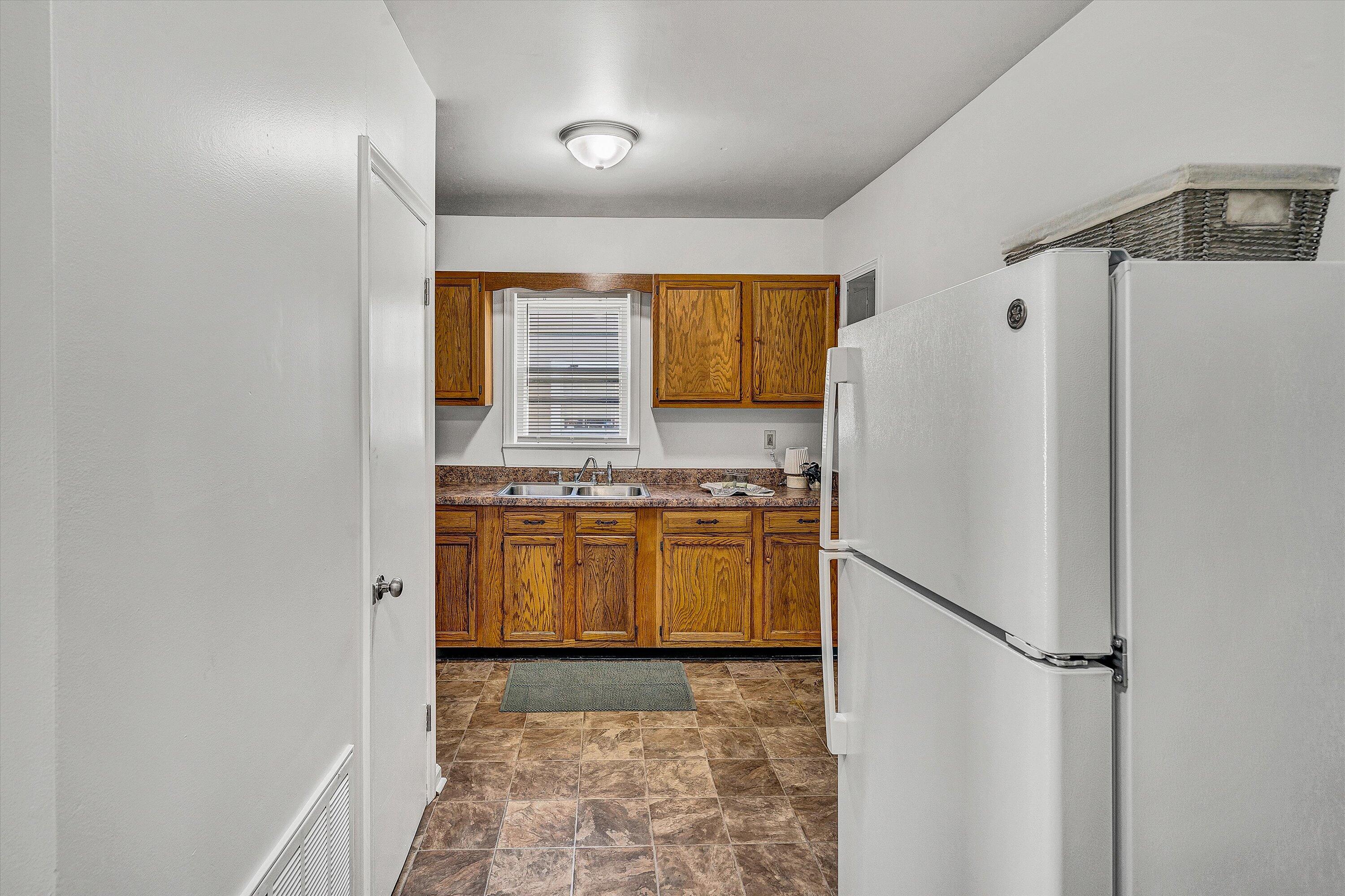 115 Liberty Road Northeast Roanoke, VA 24012 - Photo 10 of 24 a kitchen with stainless steel appliances a refrigerator and a stove