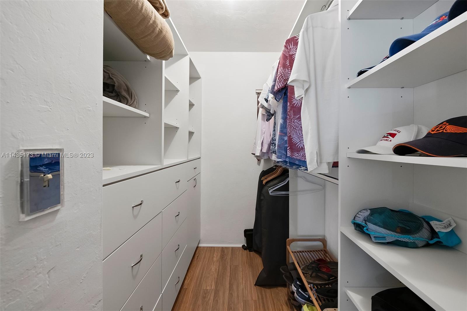 3111 North Ocean Drive, Unit 512 Hollywood, FL 33019 - Photo 14 of 33 a view of walk in closet with clothes and shoes