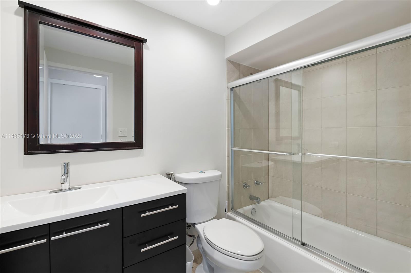 3111 North Ocean Drive, Unit 512 Hollywood, FL 33019 - Photo 19 of 33 a bathroom with a sink a toilet and shower