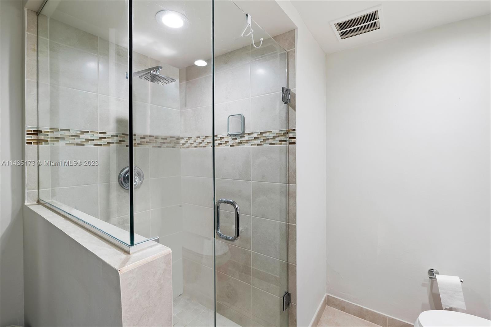 3111 North Ocean Drive, Unit 512 Hollywood, FL 33019 - Photo 21 of 33 a bathroom with a shower and toilet