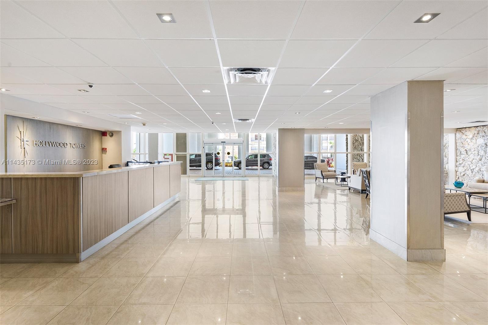 3111 North Ocean Drive, Unit 512 Hollywood, FL 33019 - Photo 25 of 33 a view of a room with lots of wooden furniture and windows