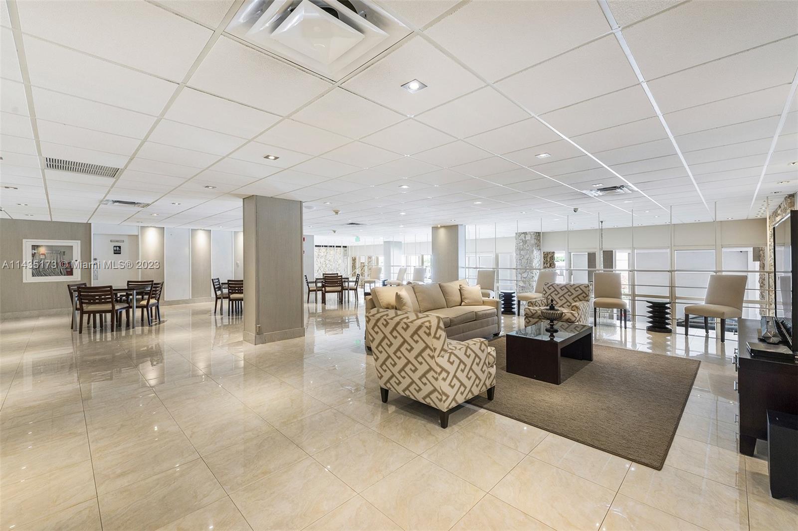 3111 North Ocean Drive, Unit 512 Hollywood, FL 33019 - Photo 29 of 33 a living room with furniture and a table