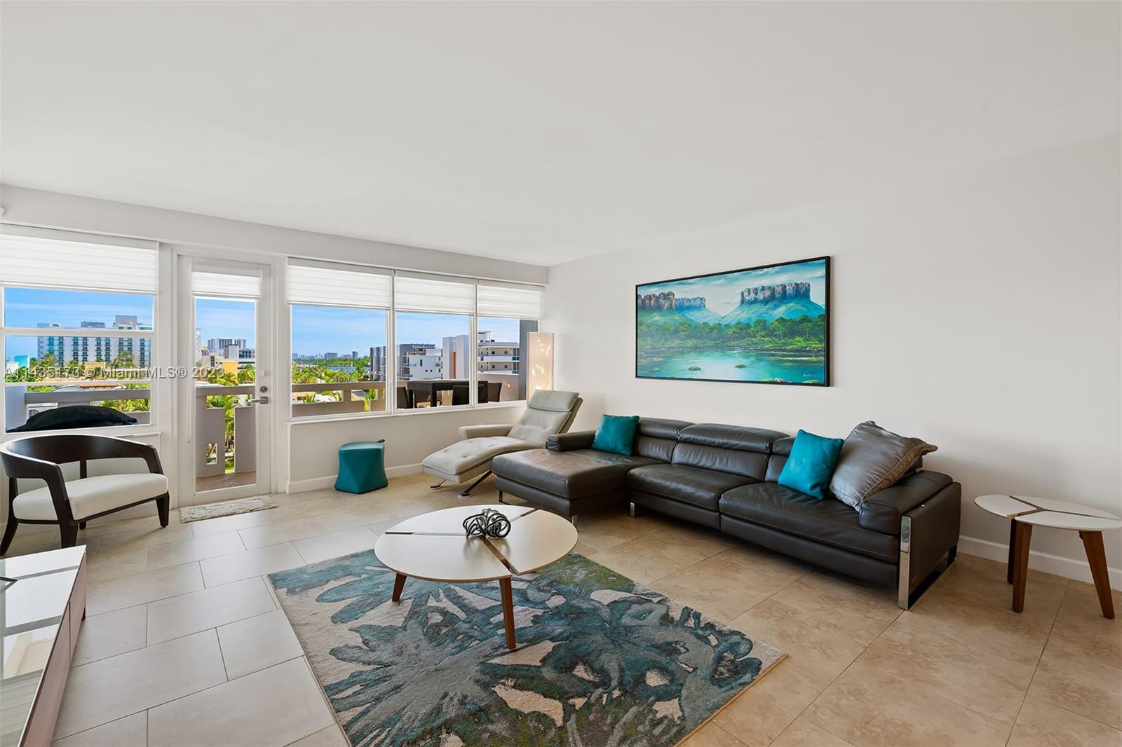 3111 North Ocean Drive, Unit 512 Hollywood, FL 33019 - Photo 4 of 33 a living room with furniture and a large window