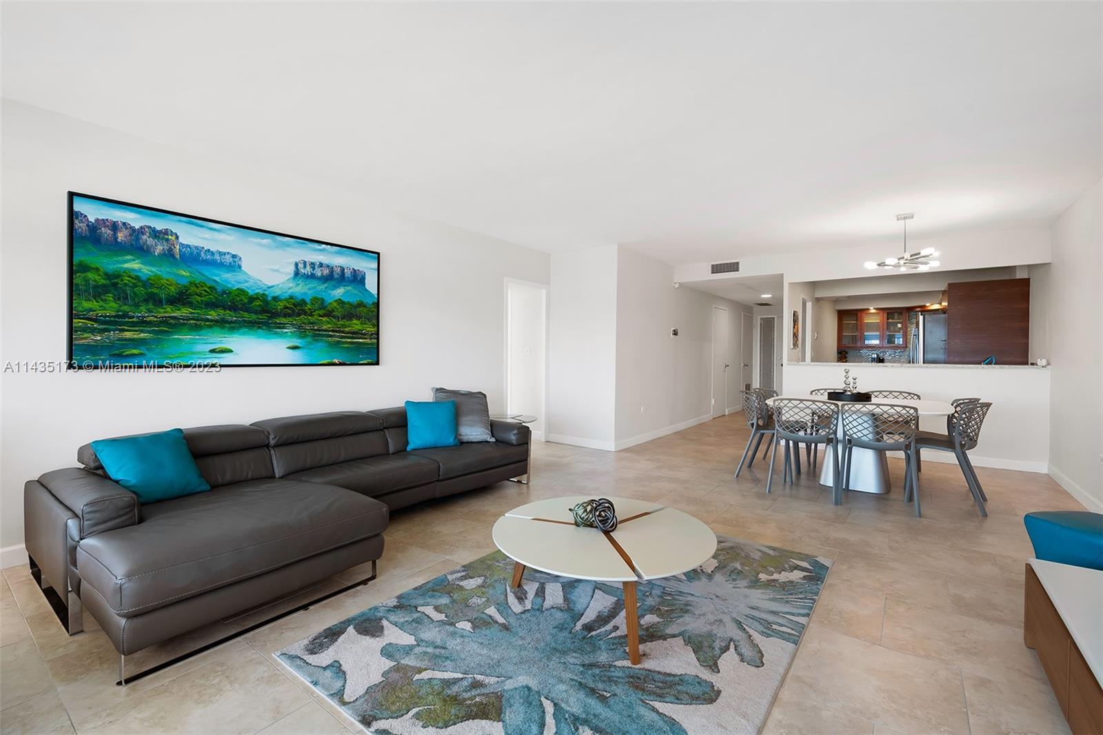 3111 North Ocean Drive, Unit 512 Hollywood, FL 33019 - Photo 5 of 33 a living room with furniture and a flat screen tv