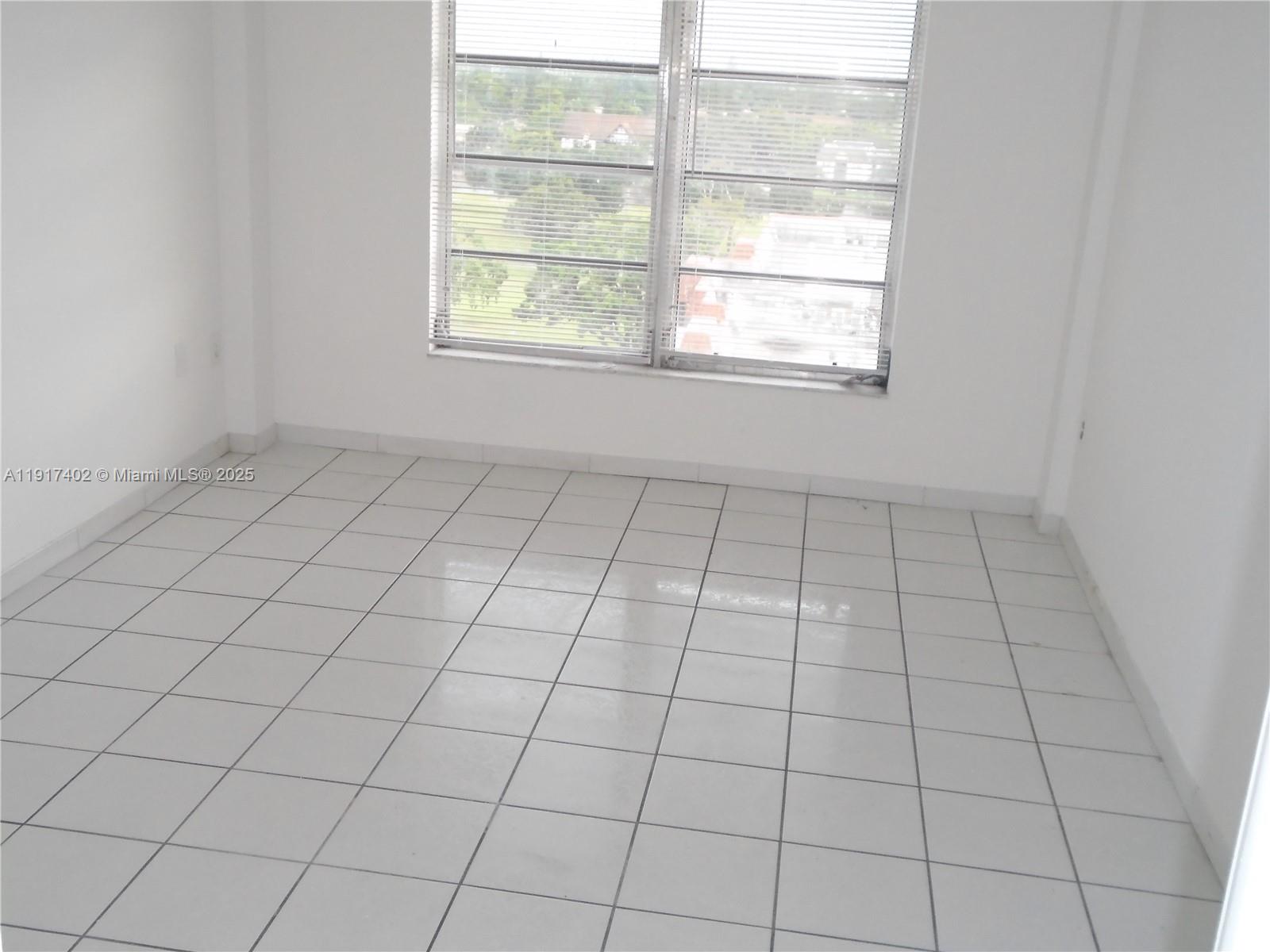 4174 Inverrary Drive, Unit 1004 Lauderhill, FL 33319 - Photo 17 of 53 a view of an empty room and window