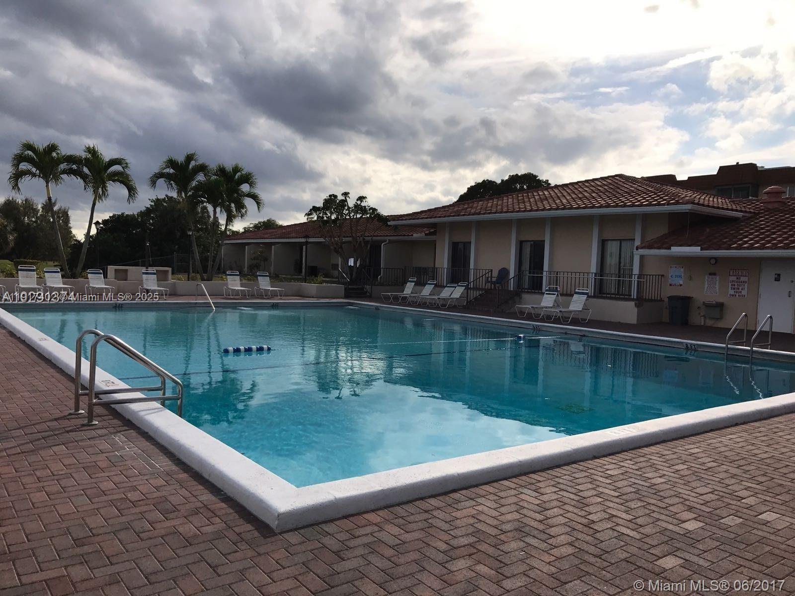 4174 Inverrary Drive, Unit 1004 Lauderhill, FL 33319 - Photo 2 of 53 a view of a lake with a terrace