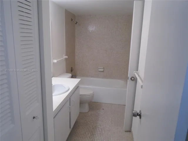 a bathroom with a sink toilet and vanity