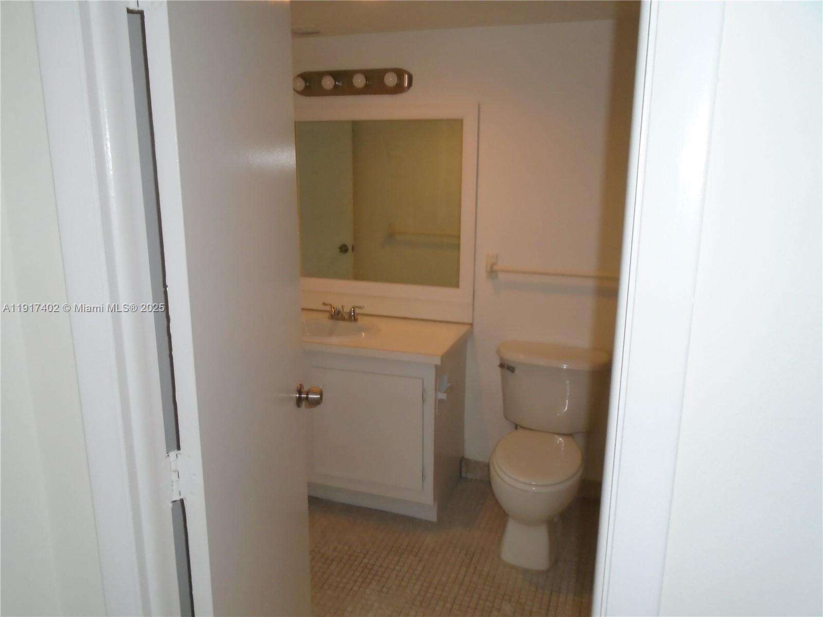 4174 Inverrary Drive, Unit 1004 Lauderhill, FL 33319 - Photo 25 of 53 a bathroom with a toilet