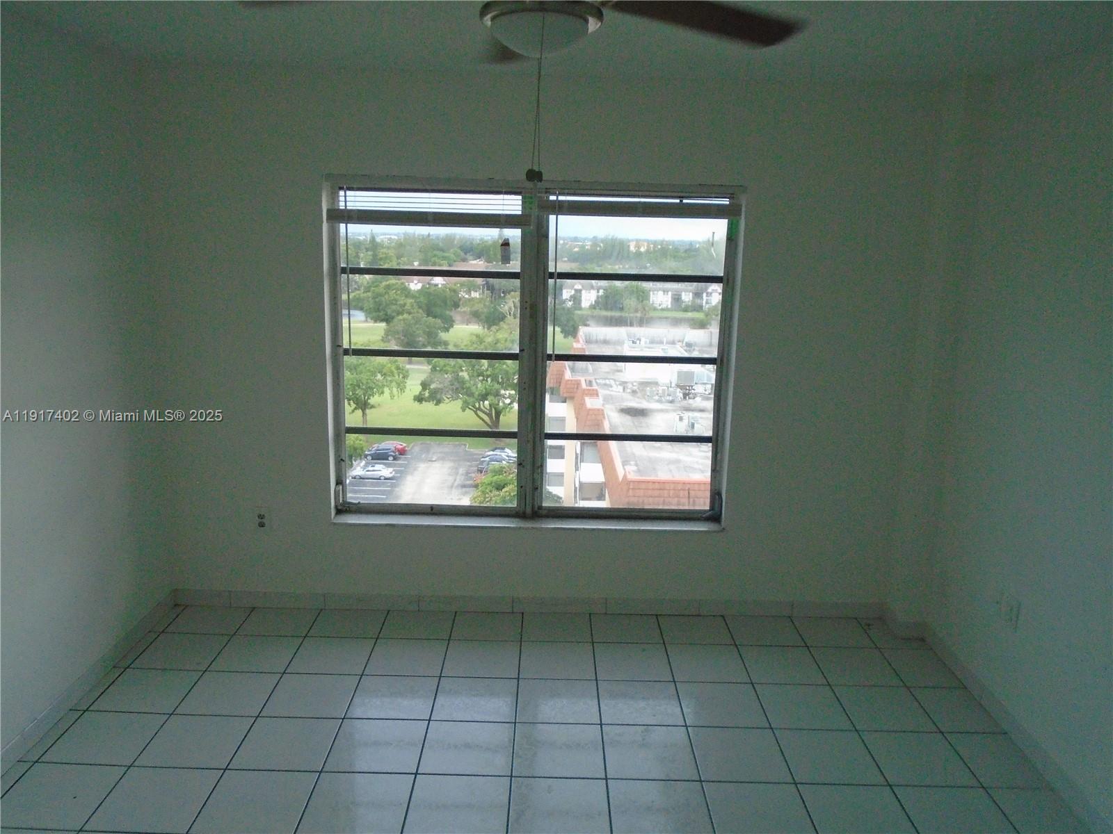 4174 Inverrary Drive, Unit 1004 Lauderhill, FL 33319 - Photo 27 of 53 a view of an empty room with a window