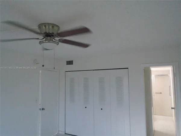 a bathroom with a shower and a glass door