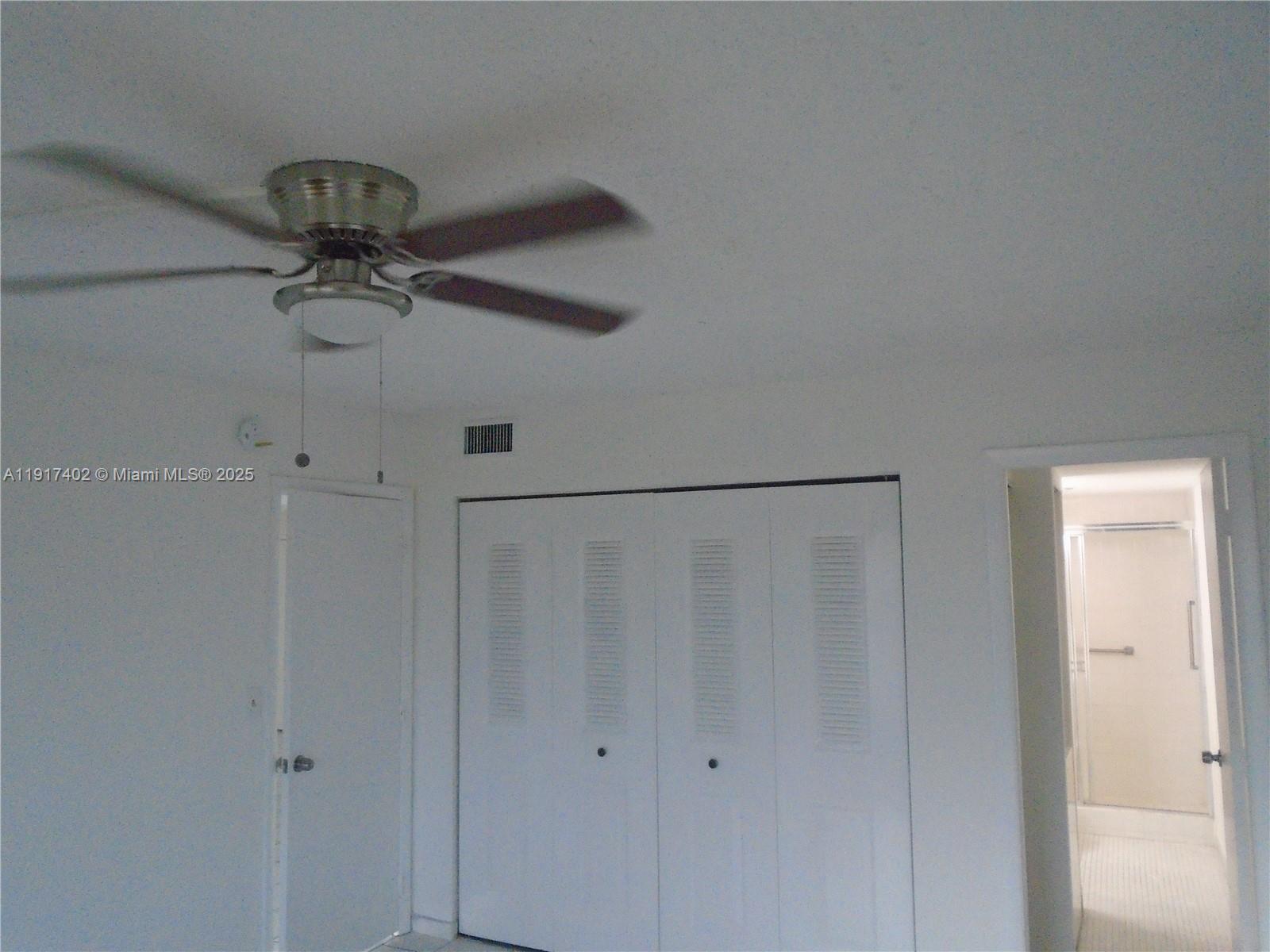 4174 Inverrary Drive, Unit 1004 Lauderhill, FL 33319 - Photo 28 of 53 a view of a chandelier fan in a room