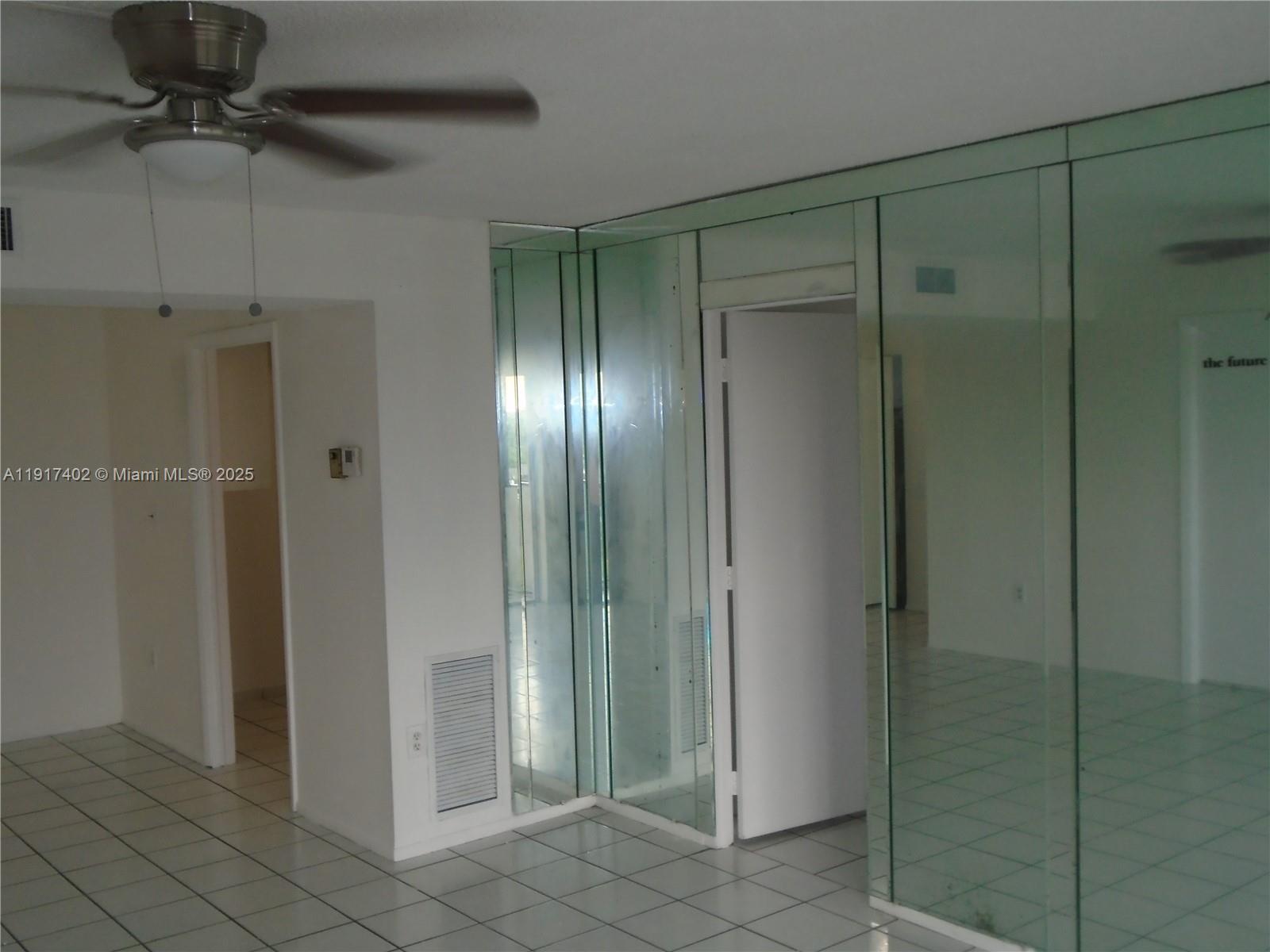 4174 Inverrary Drive, Unit 1004 Lauderhill, FL 33319 - Photo 29 of 53 a bathroom with a shower and a glass door