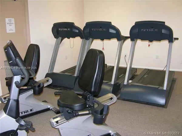 a view of gym equipment and windows