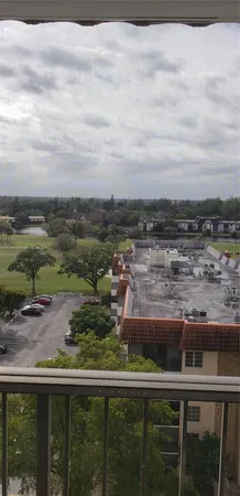 a kitchen with granite countertop a cabinets and a stove top oven