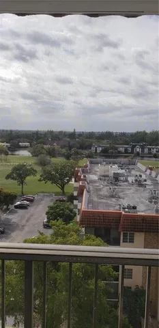 a kitchen with granite countertop a cabinets and a stove top oven