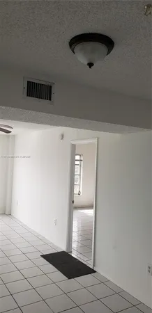 a stove top oven sitting inside of a kitchen