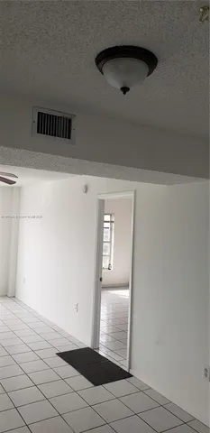 a stove top oven sitting inside of a kitchen