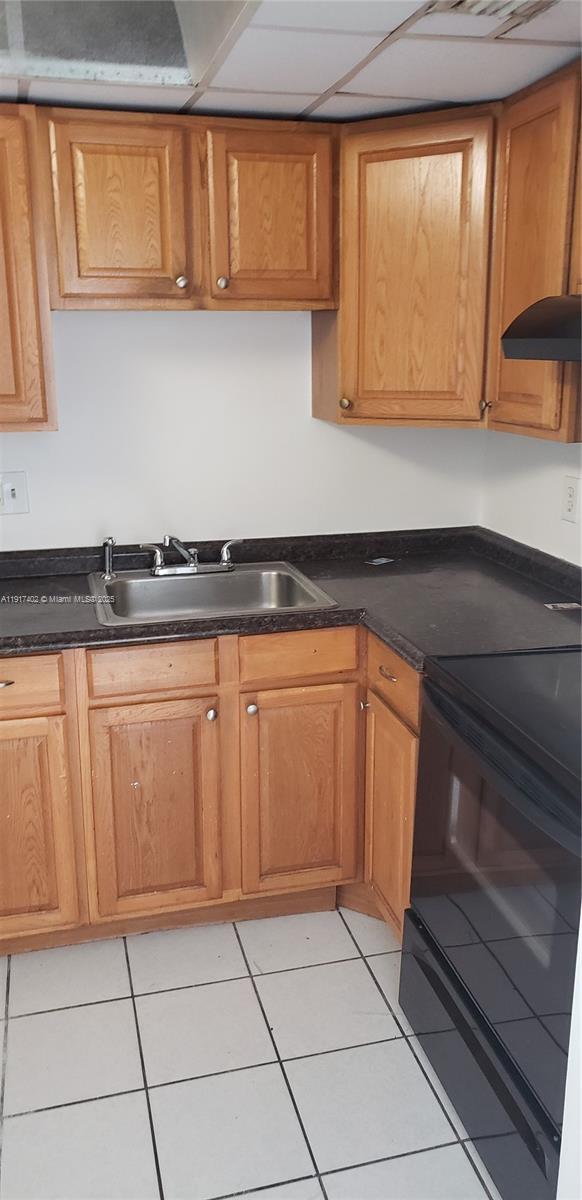 4174 Inverrary Drive, Unit 1004 Lauderhill, FL 33319 - Photo 46 of 53 a kitchen with granite countertop a cabinets and a stove top oven