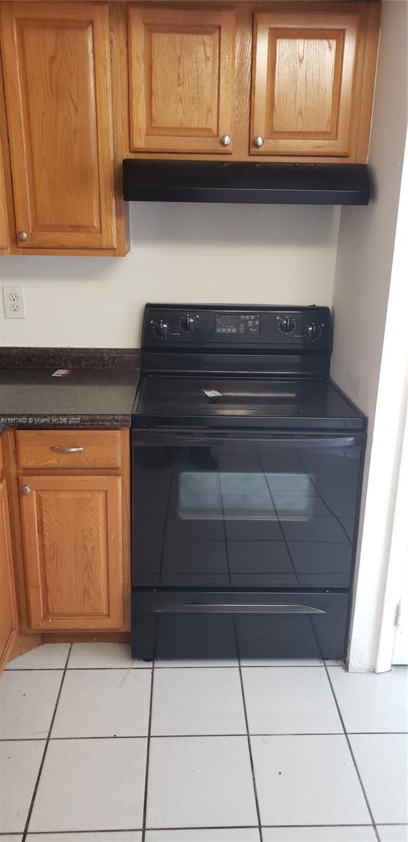 4174 Inverrary Drive, Unit 1004 Lauderhill, FL 33319 - Photo 47 of 53 a stove top oven sitting inside of a kitchen