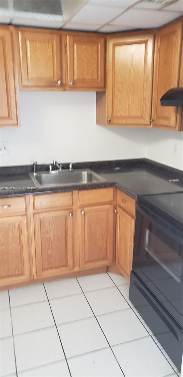 4174 Inverrary Drive, Unit 1004 Lauderhill, FL 33319 - Photo 49 of 53 a view of a kitchen with microwave and cabinets