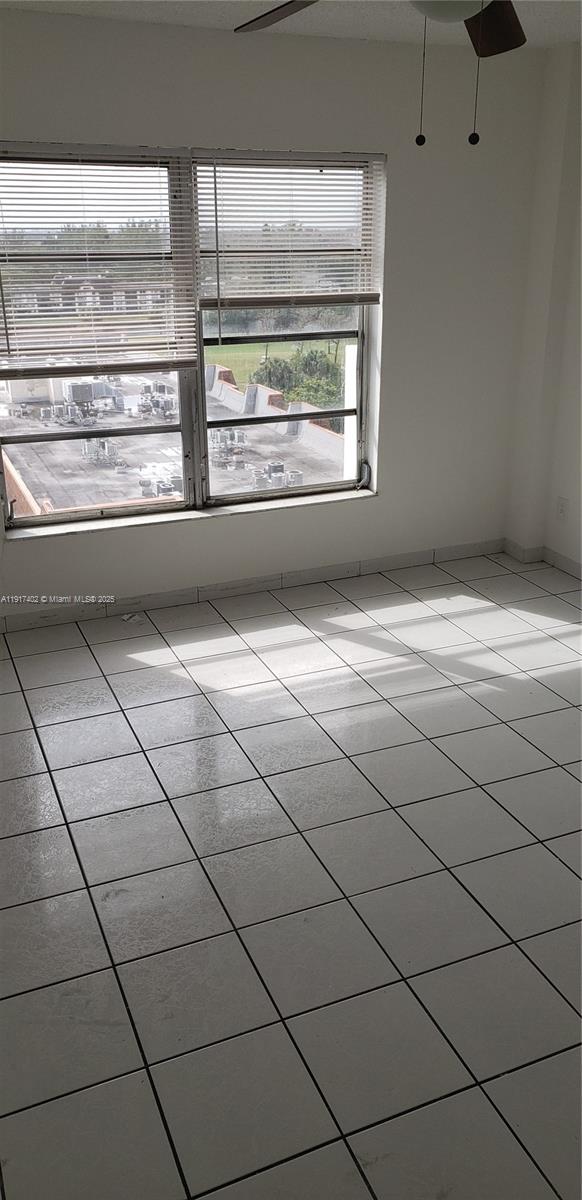 4174 Inverrary Drive, Unit 1004 Lauderhill, FL 33319 - Photo 51 of 53 a view of a livingroom with white and white cabinets