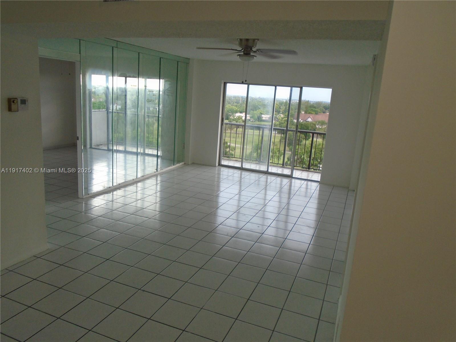 4174 Inverrary Drive, Unit 1004 Lauderhill, FL 33319 - Photo 9 of 53 a view of an empty room and window