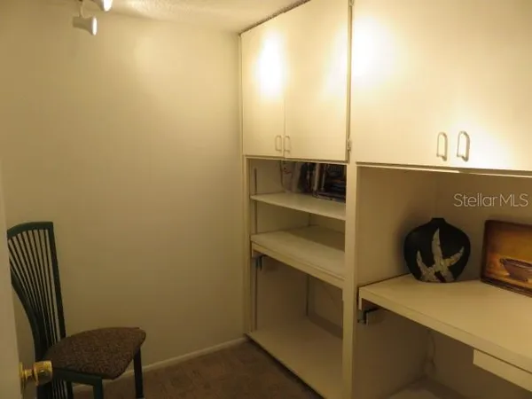 a view of storage and utility room with washer and dryer