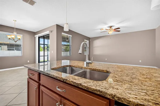 a kitchen with granite countertop a sink and a granite counter tops