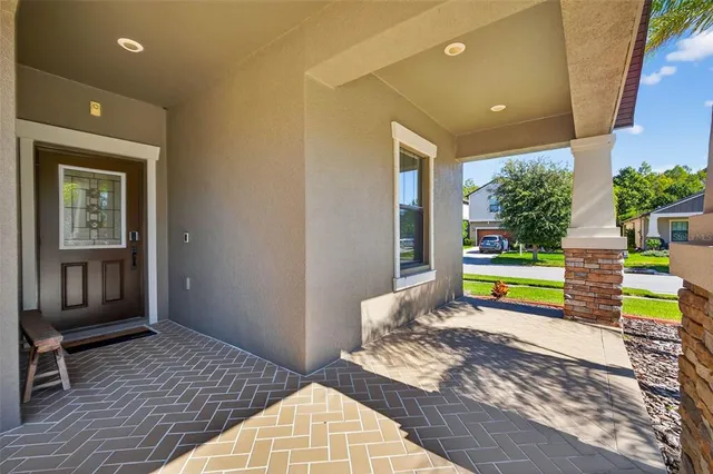 a bedroom with a bed and a view of outdoor space