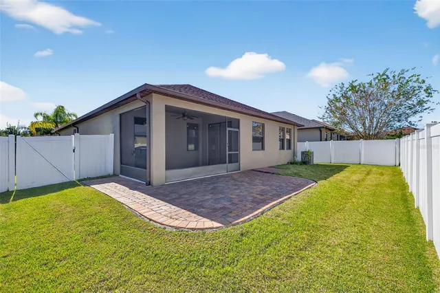 a view of a house with a yard and a garden