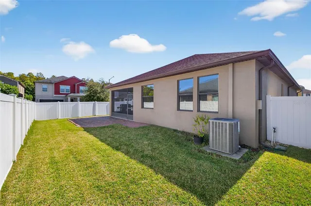 a view of backyard with a garden and entertaining space