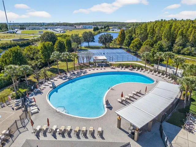 a view of a swimming pool with a table and chairs