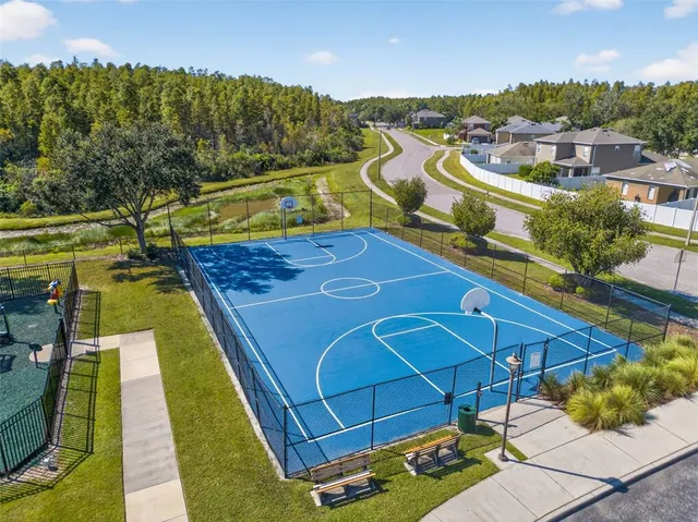 swimming pool view with a seating space