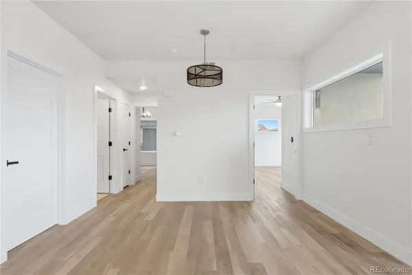 a view of a room with wooden floor