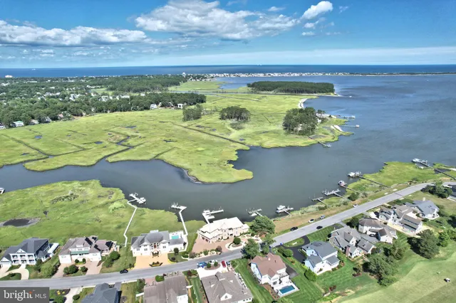 a bathroom with a double vanity sink a mirror and a shower