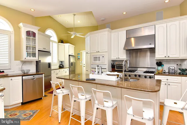 a view of entryway with a front door and wooden floor