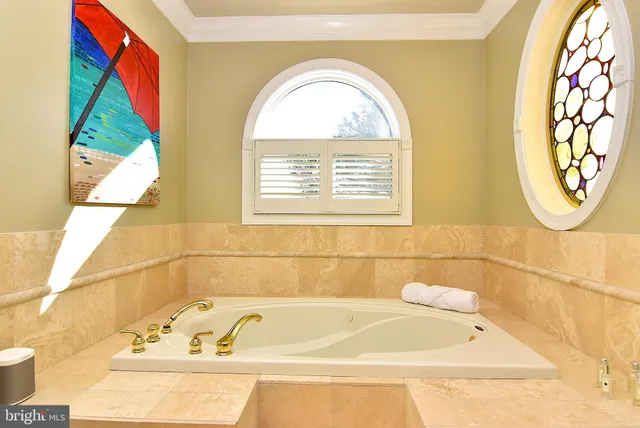 a view of living room and hall way with furniture