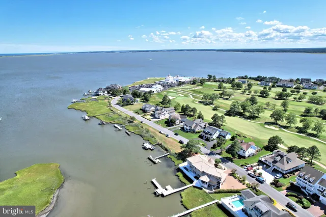 a view of a swimming pool and a yard