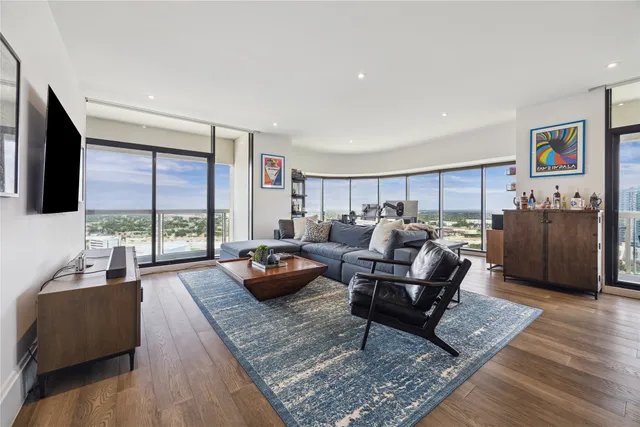 a living room with furniture rug and window