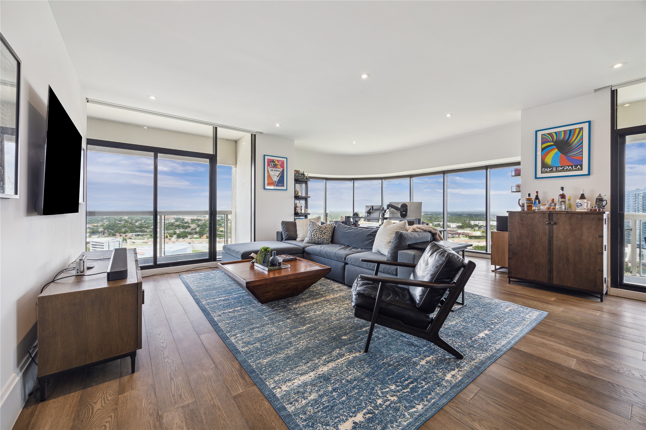 a living room with furniture rug and window