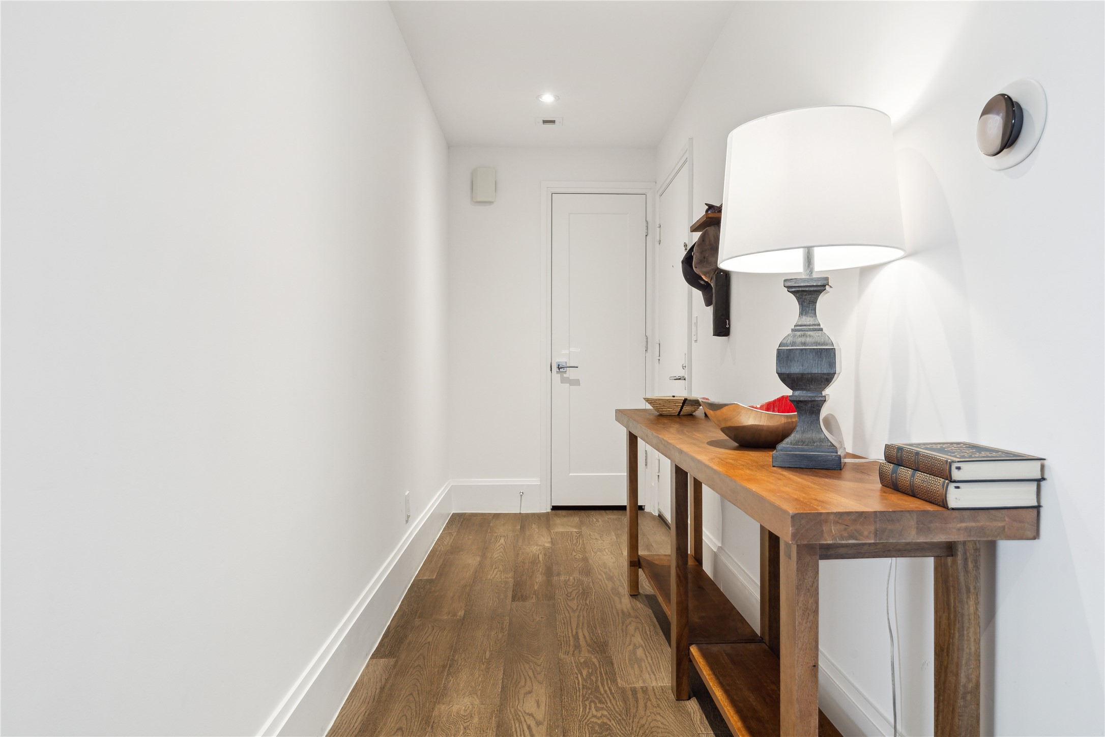 1701 Hermann Drive, Unit 23B Houston, TX 77004 - Photo 4 of 24 a view of hallway with wooden floor