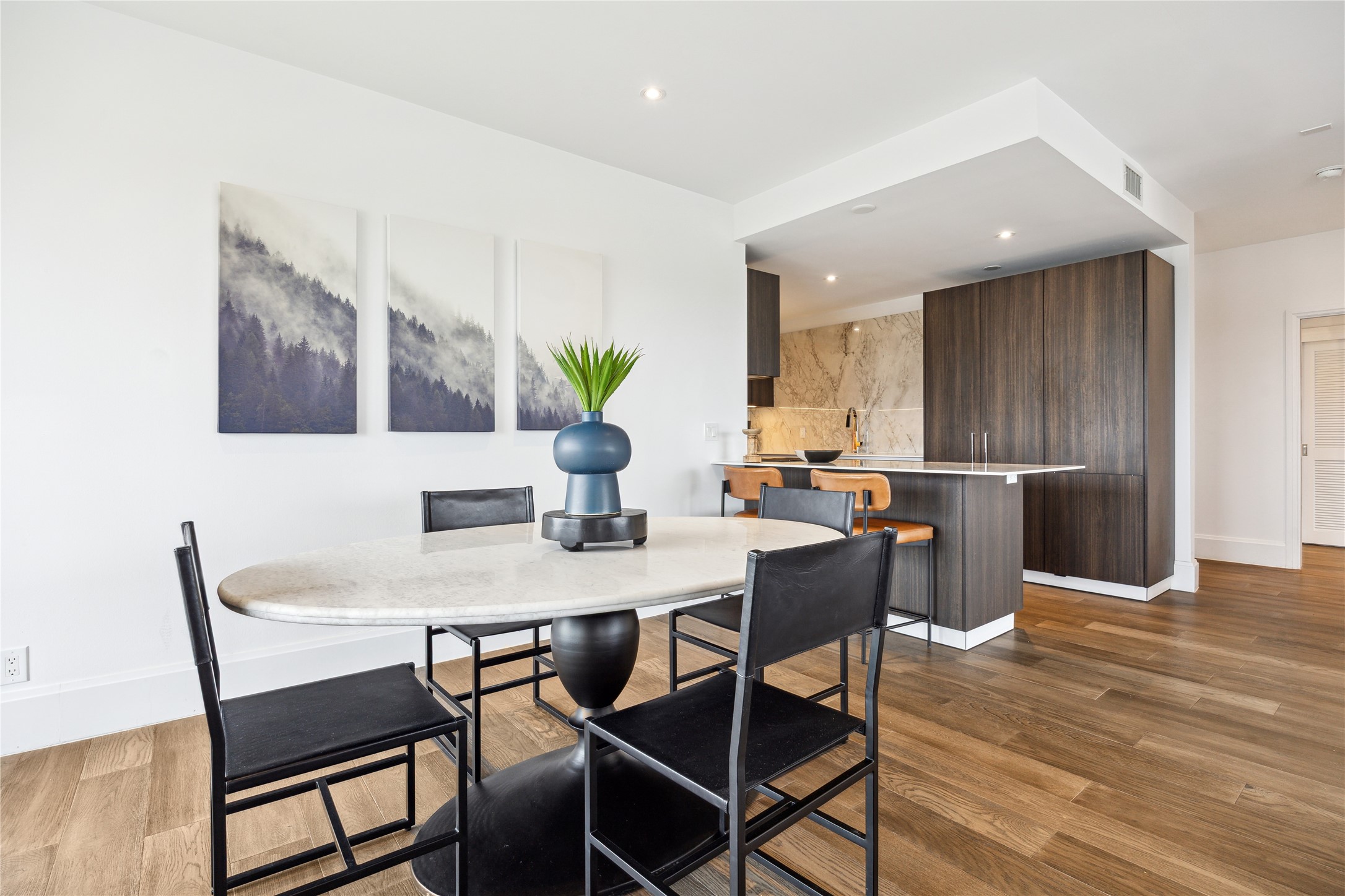 1701 Hermann Drive, Unit 23B Houston, TX 77004 - Photo 9 of 24 a view of a dining room with furniture and wooden floor