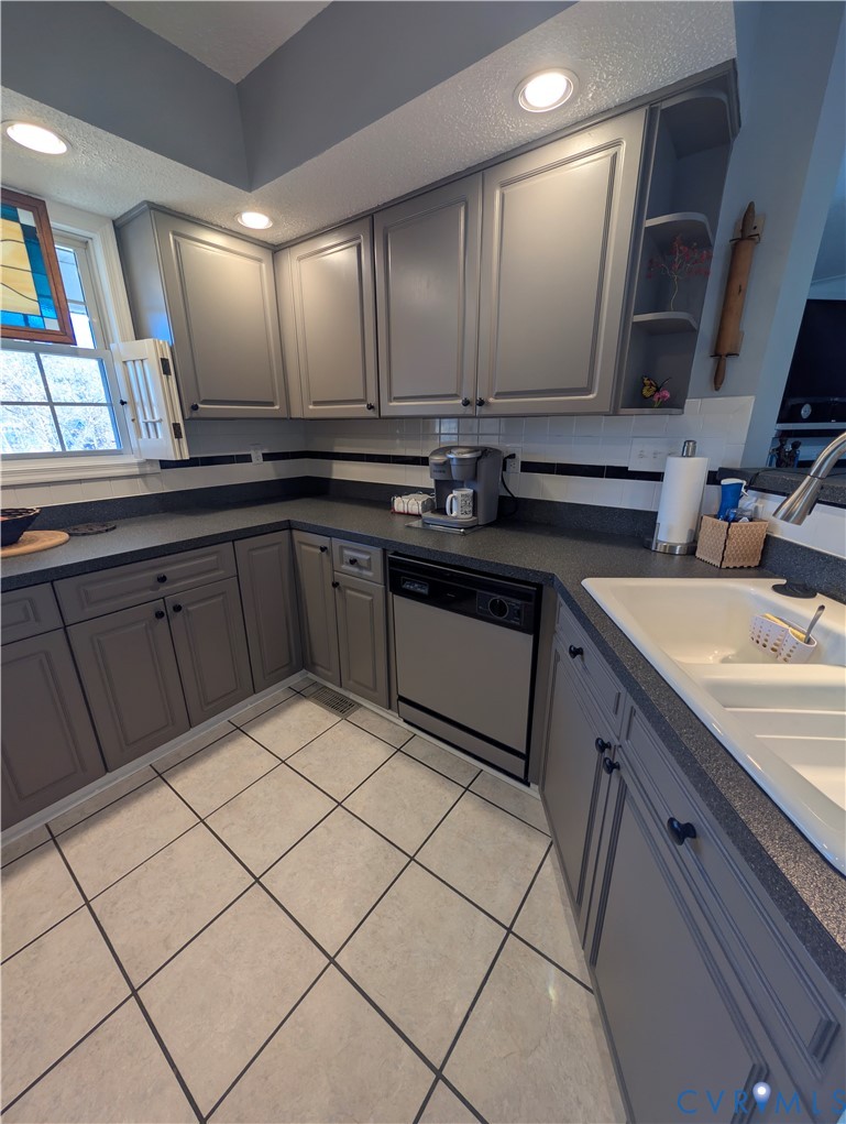 2701 Executive Drive Chester, VA 23831 - Photo 11 of 27 Kitchen featuring gray cabinets, lot of countertop