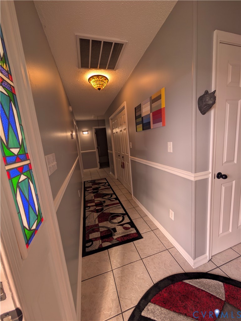 2701 Executive Drive Chester, VA 23831 - Photo 13 of 27 Hallway featuring light Italian tile floors.