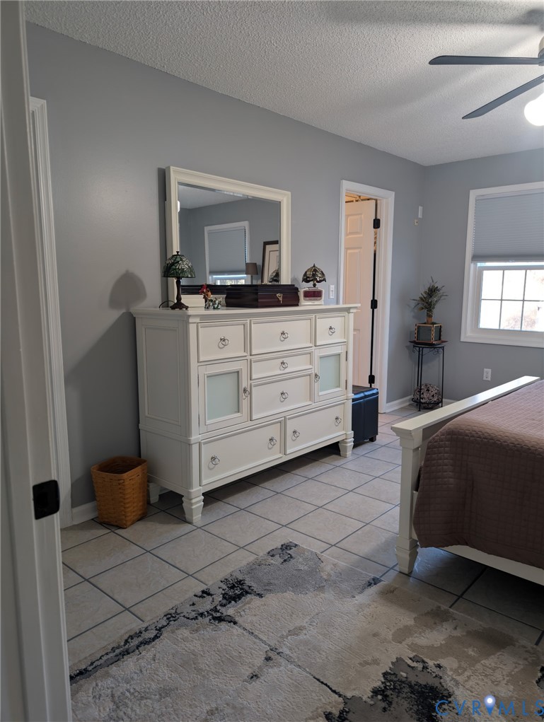 2701 Executive Drive Chester, VA 23831 - Photo 15 of 27 Master Bedroom with a ceiling fan, light tile patt
