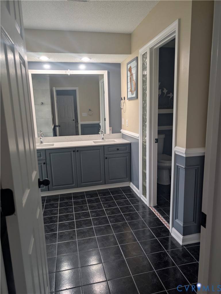 2701 Executive Drive Chester, VA 23831 - Photo 17 of 27 Master Bathroom featuring double vanity, and dark