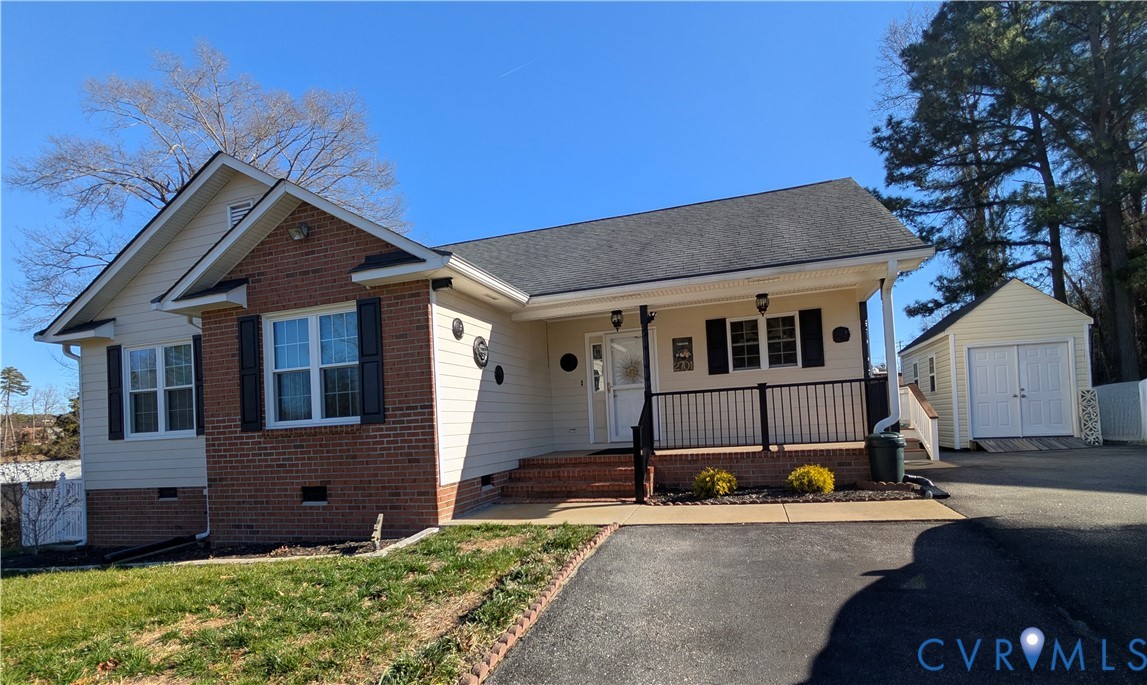 2701 Executive Drive Chester, VA 23831 - Photo 2 of 27 View of front of home with covered porch, paved dr
