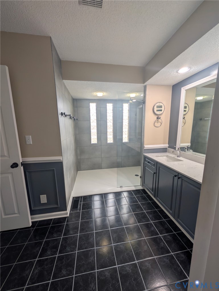 2701 Executive Drive Chester, VA 23831 - Photo 21 of 27 Full bath featuring a walk in shower, vanity, a te