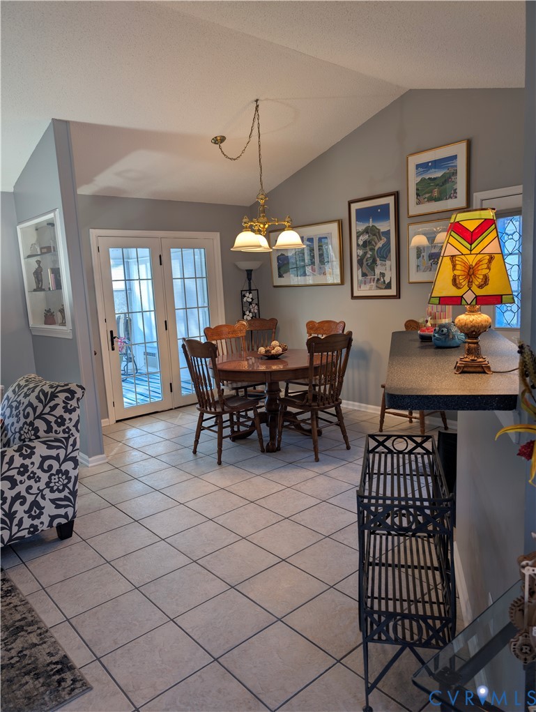 2701 Executive Drive Chester, VA 23831 - Photo 9 of 27 Dining space featuring vaulted ceiling and light t